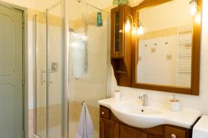 a bathroom with a sink and a shower at il nuvoloso 2 in Città della Pieve