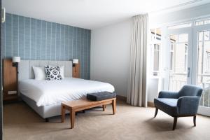 Postel nebo postele na pokoji v ubytování Grand Hotel Ter Duin