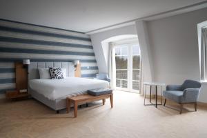 Postel nebo postele na pokoji v ubytování Grand Hotel Ter Duin