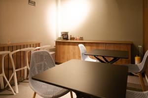 a meeting room with a table and chairs at Fence by Bernalo Hotels in Medellín