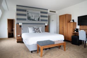 Postel nebo postele na pokoji v ubytování Grand Hotel Ter Duin