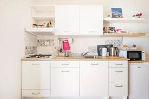 A kitchen or kitchenette at Appartamento Turistico L'ulivo