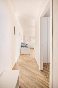 A bed or beds in a room at Appartamento Turistico L'ulivo
