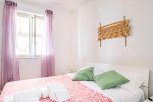 A bed or beds in a room at Appartamento Turistico L'ulivo