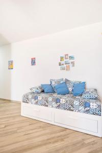 A bed or beds in a room at Appartamento Turistico L'ulivo