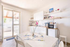 A kitchen or kitchenette at Appartamento Turistico L'ulivo