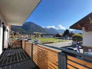 a balcony with a view of a mountain at AlpSuites Oberstdorf in Oberstdorf
