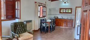 a kitchen with a table and chairs in a room at La Elvira in San Antonio de Areco +16 photos