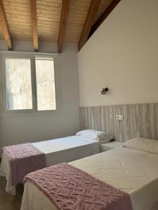 Postel nebo postele na pokoji v ubytování Reginita Apartamentos