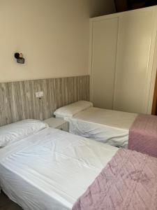 Postel nebo postele na pokoji v ubytování Reginita Apartamentos