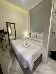 Postel nebo postele na pokoji v ubytování Resong Hotel