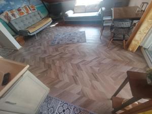 an overhead view of a living room with a wooden floor at City Center by Harbour First Floor in Marmaris