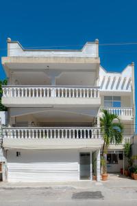 a large white house with a balcony at Hotel Turquesa in Playa del Carmen