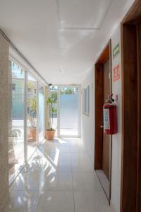 a hallway with a fire hydrant in a building at Hotel Turquesa in Playa del Carmen +6 photos