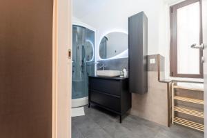 a bathroom with a sink and a shower at La Dimora degli Attori in Catania +64 photos