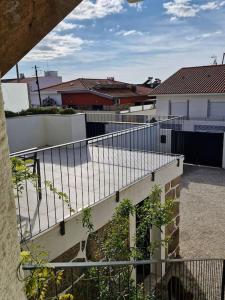 a view of a balcony of a building with a fence at Casa Francisca praia de Mindelo in Mindelo +32 photos