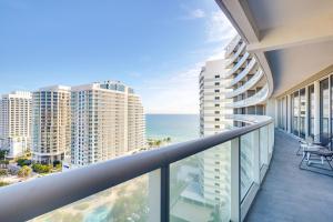 an apartment balcony with a view of the ocean at Resort Perks Luxe Florida Condo Near Restaurants! in Fort Lauderdale