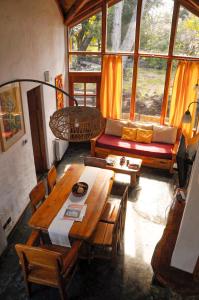 a living room with a table and a couch at Lelikelen Cabañas del Bosque in Villa La Angostura