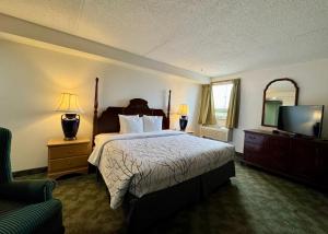 Postel nebo postele na pokoji v ubytování Best Stay Inn