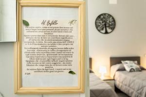 a picture of a poem in a frame in a bedroom at Al CASTELLO AVEZZANO in Avezzano +39 photos