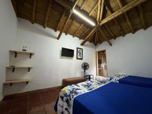 Postel nebo postele na pokoji v ubytování Finca Hotel San Cristobal Quindio