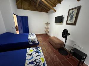 Postel nebo postele na pokoji v ubytování Finca Hotel San Cristobal Quindio