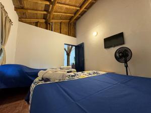 Postel nebo postele na pokoji v ubytování Finca Hotel San Cristobal Quindio