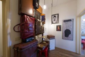 a room with a pile of suitcases on the wall at 'Amicasa in Florence