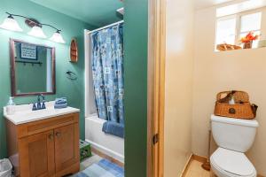 a bathroom with a toilet and a sink and a shower at Norske Nooke - Experience the best of Big Bear Walk to Bear Mountain and the Golf Course in Big Bear Lake +23 photos