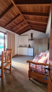 a bedroom with a bed and a kitchen in it at La Trinidad in La Guancha