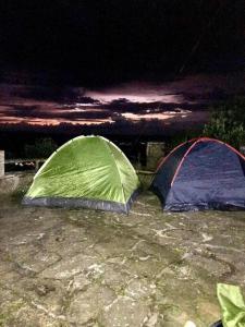 two tents sitting on the ground at night at Casa en las Nubes, Melgar Tolima in Melgar +3 photos