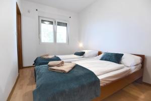 Postel nebo postele na pokoji v ubytování Bibinje Apartments