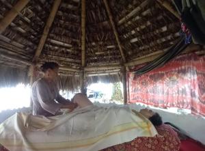 a woman sitting on a bed in a tent at Casa Campestre El Silencio con Familias Exitosas in Rivera
