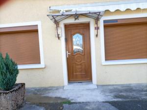 a house with two gates and a door at a patornay maison in Patornay