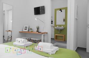 Postel nebo postele na pokoji v ubytování B&B Fuori Squadro - In Centro con Terrazza Relax vista Mare