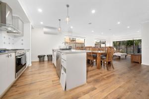 a kitchen and dining room with a table and chairs at Happy Cozy Convenient 4BR, Breezy, Near Mall, Park in Berwick