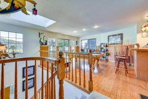 a living room with a staircase and a dining room at Spacious Idyllwild Home with Mountain Views! in Idyllwild