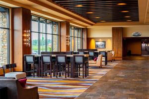 a lobby with a bar with chairs and tables at Silver Reef Casino Resort in Ferndale