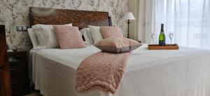 a bedroom with a bed with a pillow on it at LUXURY VILLA ZAGARA GOLF & Pool in Estepona +15 photos