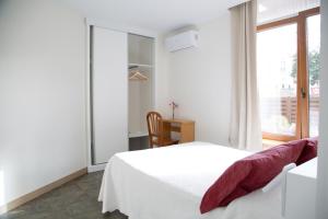 Posteľ alebo postele v izbe v ubytovaní Apartamentos Playa De Cóbreces
