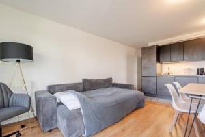 Ένα ή περισσότερα κρεβάτια σε δωμάτιο στο l'Éden familial - cosy T3 proche Disneyland avec jardin