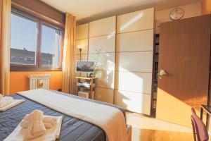 Postel nebo postele na pokoji v ubytování Camera Matrimoniale Sud Milano, Bagno Privato + 24 fotografií