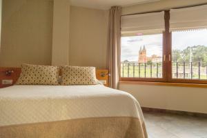 Posteľ alebo postele v izbe v ubytovaní Apartamentos Playa De Cóbreces