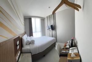 Postel nebo postele na pokoji v ubytování Front One Resort Indraloka Temanggung