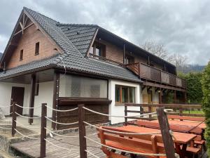 a house with a bench in front of it at Apartmán Pavčina Lehota in Pavčina Lehota