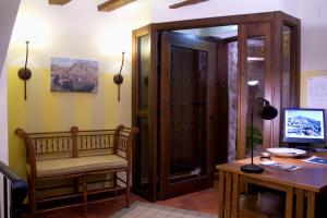 a room with a desk and a computer on a table at La Casa del tío Americano in Albarracín