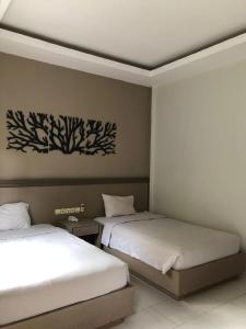 Postel nebo postele na pokoji v ubytování Front One Resort Indraloka Temanggung