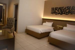Postel nebo postele na pokoji v ubytování Front One Resort Indraloka Temanggung
