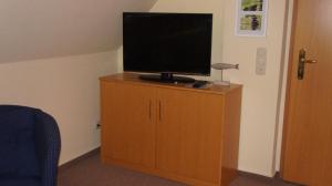 Et tv og/eller underholdning på Ferienwohnungen Bütow