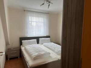 Ένα ή περισσότερα κρεβάτια σε δωμάτιο στο Strandliebe +6 φωτογραφίες